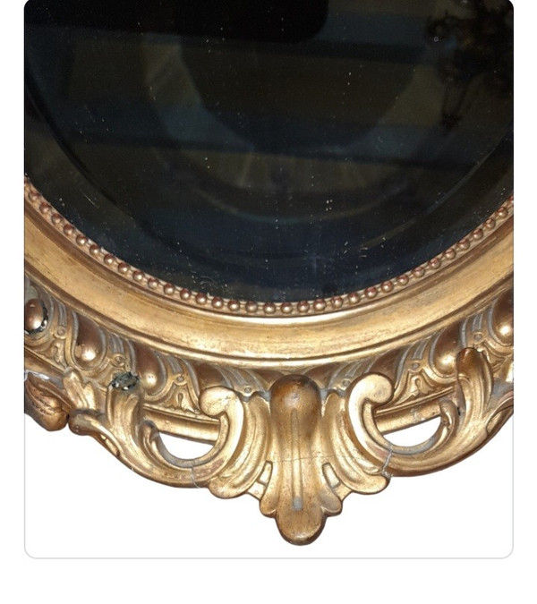 Oval gilded wood mirror