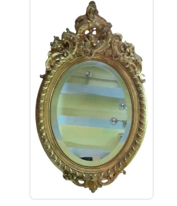 Oval gilded wood mirror