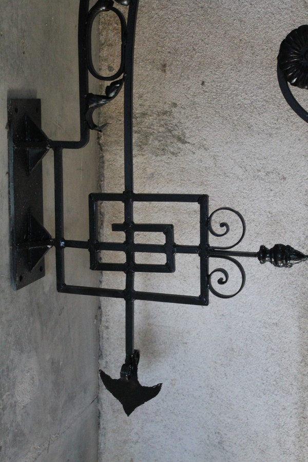 Pair of large wrought iron gallows with Louis XVI style scrollwork, 20th century