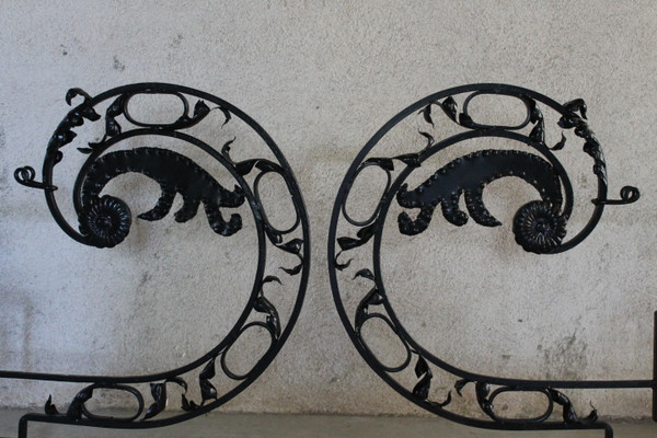 Pair of large wrought iron gallows with Louis XVI style scrollwork, 20th century