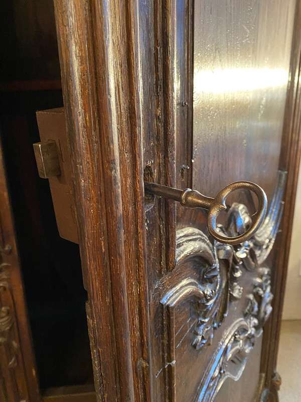 Carved oak cabinet decorated with foliage and flowers, late 18th century