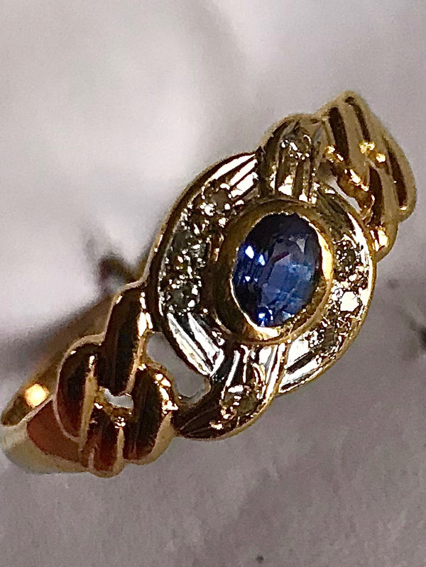 750/1000 gold sapphire and diamond ribbon ring