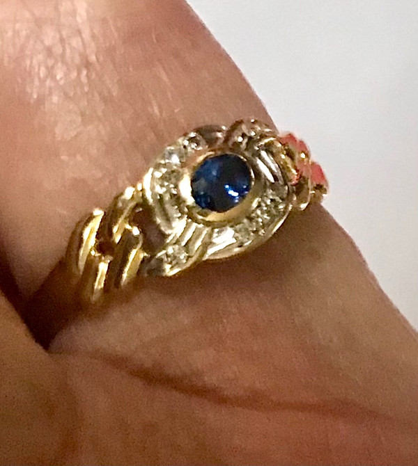 750/1000 gold sapphire and diamond ribbon ring