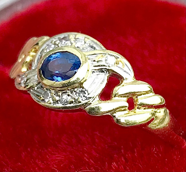 750/1000 gold sapphire and diamond ribbon ring