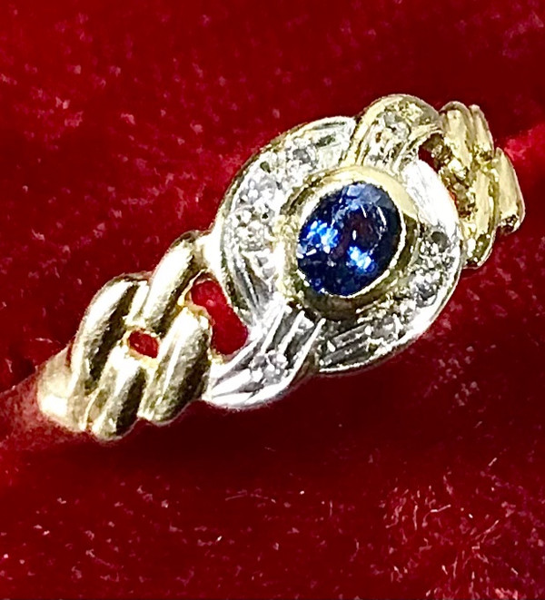 750/1000 gold sapphire and diamond ribbon ring