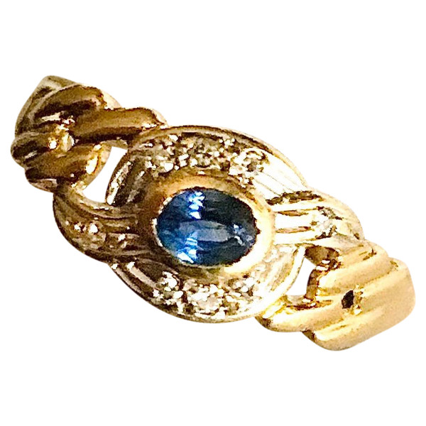 750/1000 gold sapphire and diamond ribbon ring