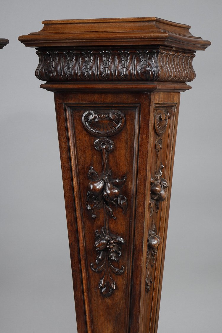 PAIR OF CARVED MOLDED WALNUT SELLETTES WITH FRUIT AND PLANT DECORATIONS