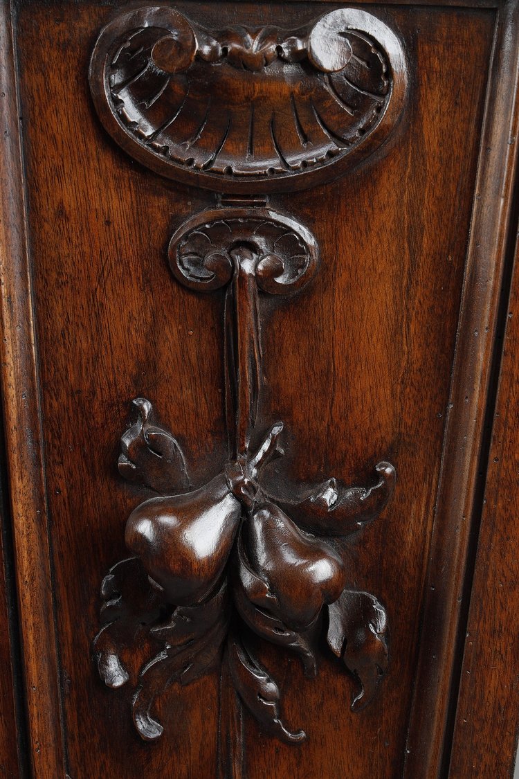 PAIR OF CARVED MOLDED WALNUT SELLETTES WITH FRUIT AND PLANT DECORATIONS