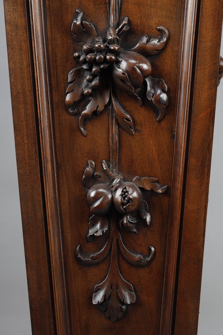 PAIR OF CARVED MOLDED WALNUT SELLETTES WITH FRUIT AND PLANT DECORATIONS