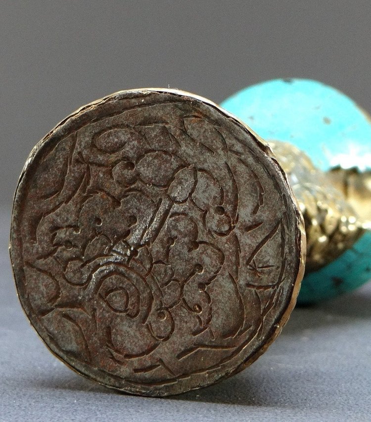 Tibet, Early 20th Century, Repoussé Copper and Turquoise Seal on a Shell Base.