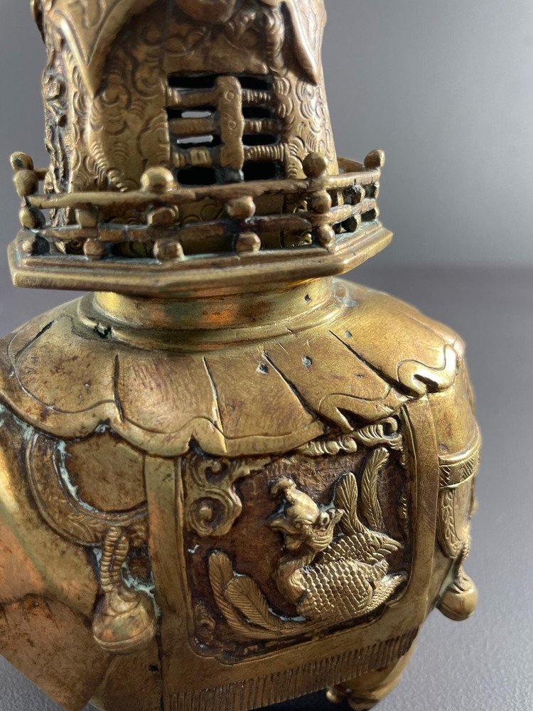 China, First Third of the 20th Century, Bronze Incense Burner with Gilded Patina Depicting an Elephant.