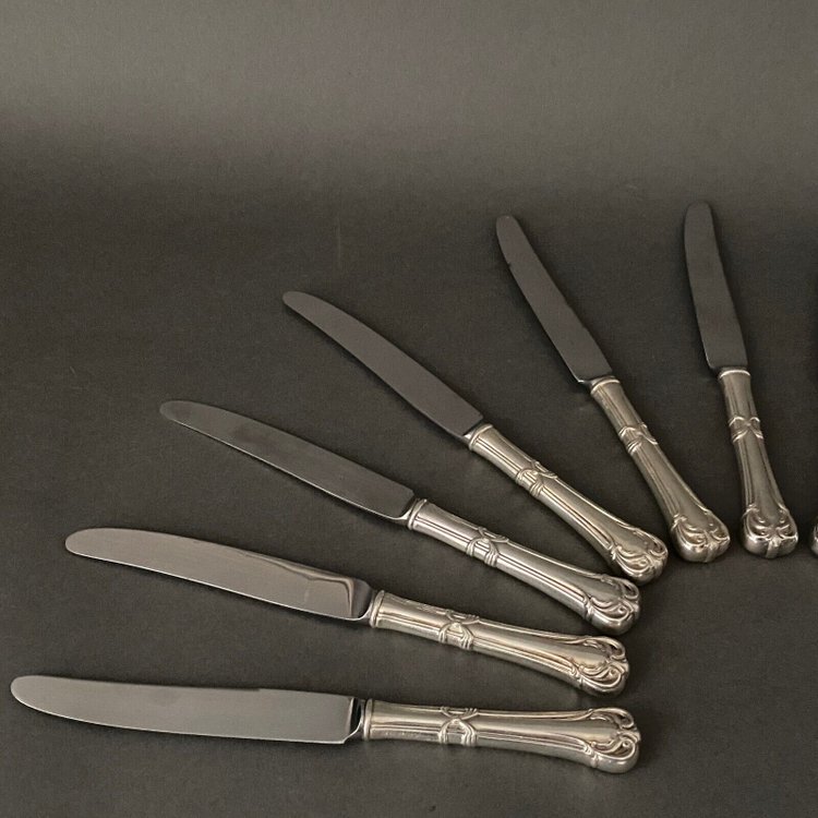 Suite of 24 Mexican silver knives, Louis XV style, early 20th century