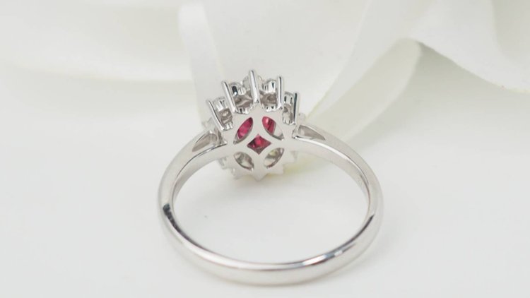 Surrounding ring in white gold, rubies and diamonds