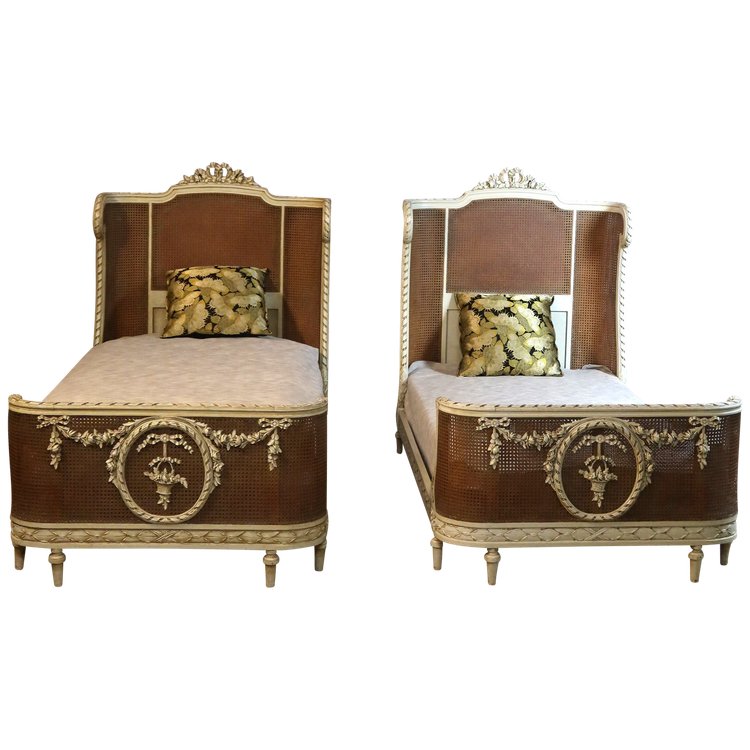 Pair of Louis XVI style caned beds