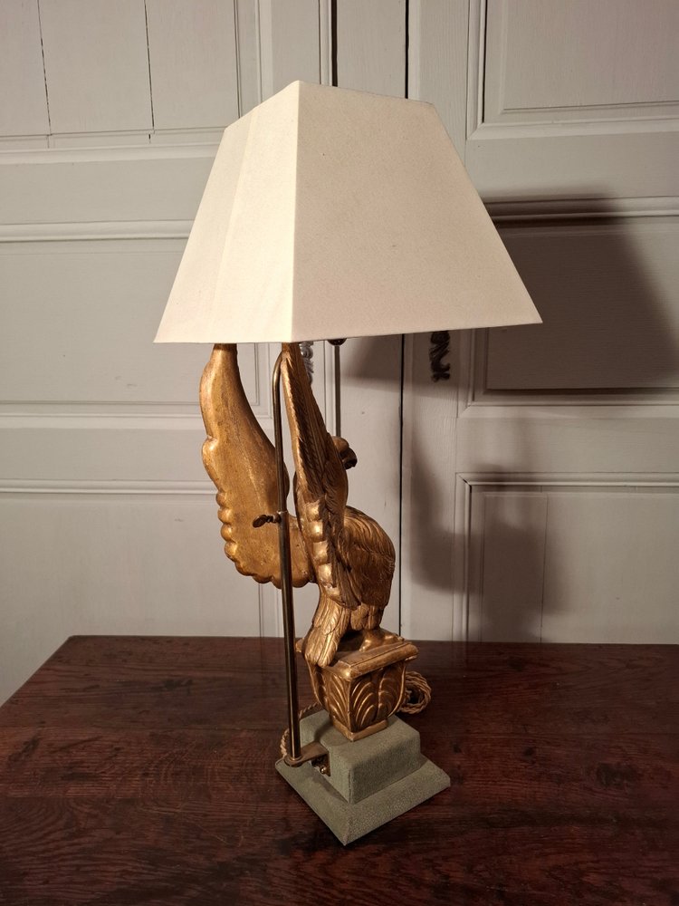 Lampe aigle en bois doré d’époque XIXème siècle.