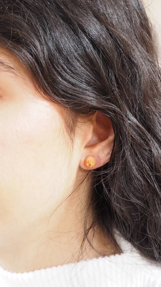 Carved coral and yellow gold earrings