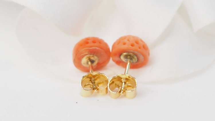 Carved coral and yellow gold earrings