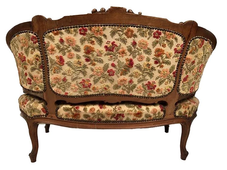 Small Rocaille-style sofa in richly carved walnut, 19th century