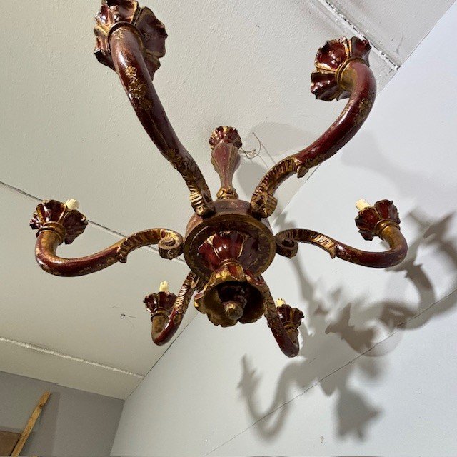 Antique Six Arm Chandelier 19th century era painted ruby and gold . All carved .