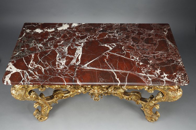 LARGE RECTANGULAR CONSOLE IN RICHLY CARVED AND GILDED WOOD