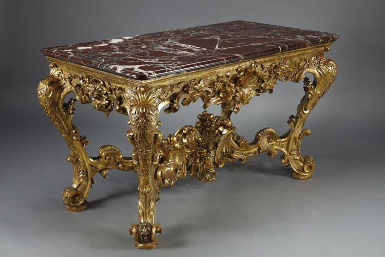 LARGE RECTANGULAR CONSOLE IN RICHLY CARVED AND GILDED WOOD