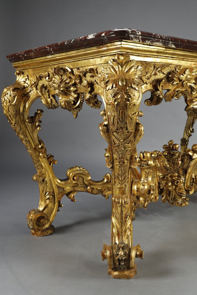 LARGE RECTANGULAR CONSOLE IN RICHLY CARVED AND GILDED WOOD