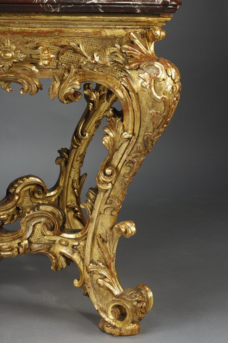 LARGE RECTANGULAR CONSOLE IN RICHLY CARVED AND GILDED WOOD