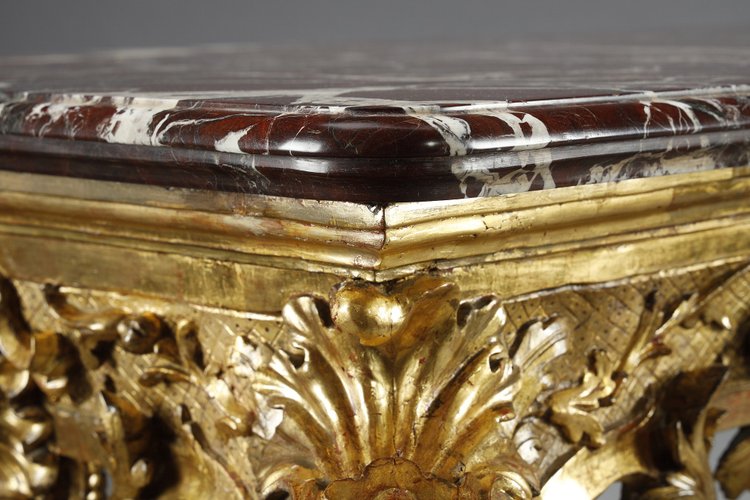 LARGE RECTANGULAR CONSOLE IN RICHLY CARVED AND GILDED WOOD