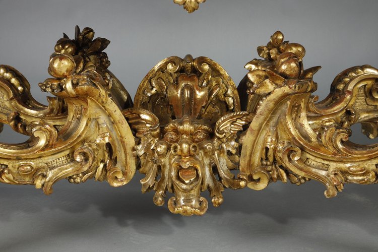 LARGE RECTANGULAR CONSOLE IN RICHLY CARVED AND GILDED WOOD