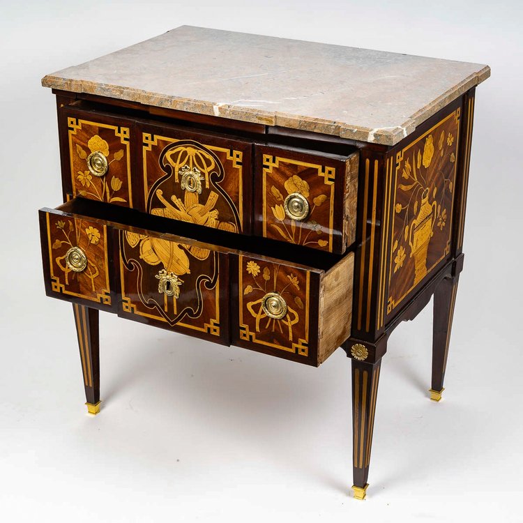 A commode Sauteuse with musical instruments marquetry, Louis XVI period circa 1780