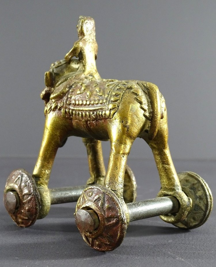 India, Early 20th Century, Bronze Cornac toy perched on an elephant.