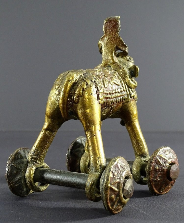 India, Early 20th Century, Bronze Cornac toy perched on an elephant.