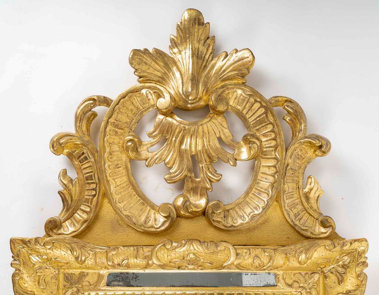 A French Regence period giltwood openwork pediment mirror circa 1720