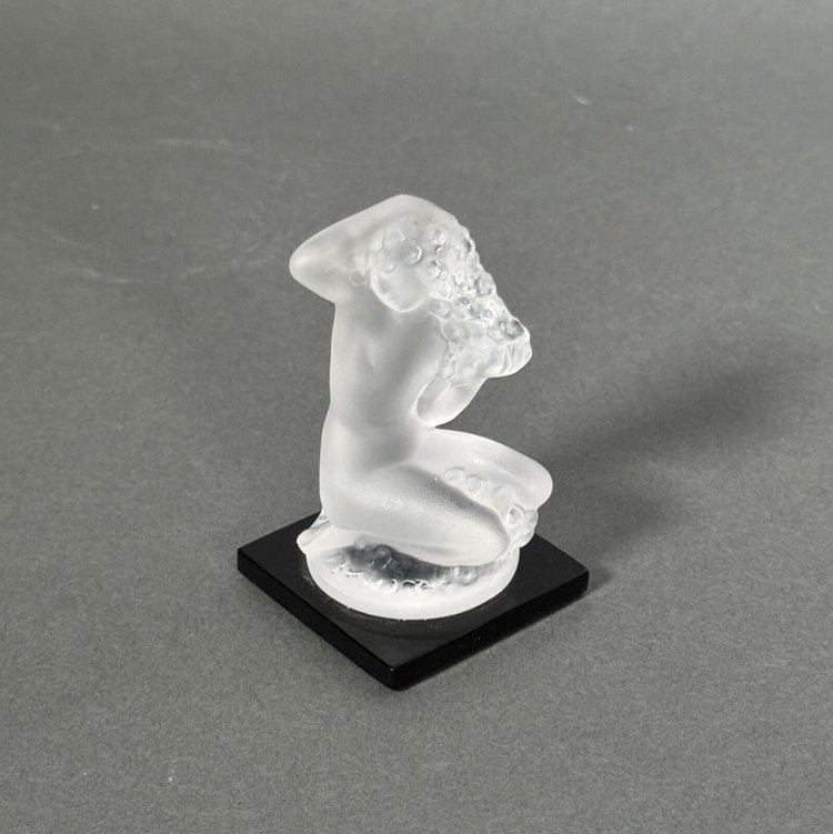 Nude female subject by Lalique in frosted glass on black base