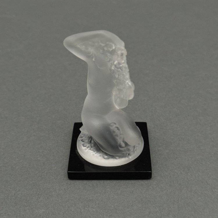 Nude female subject by Lalique in frosted glass on black base