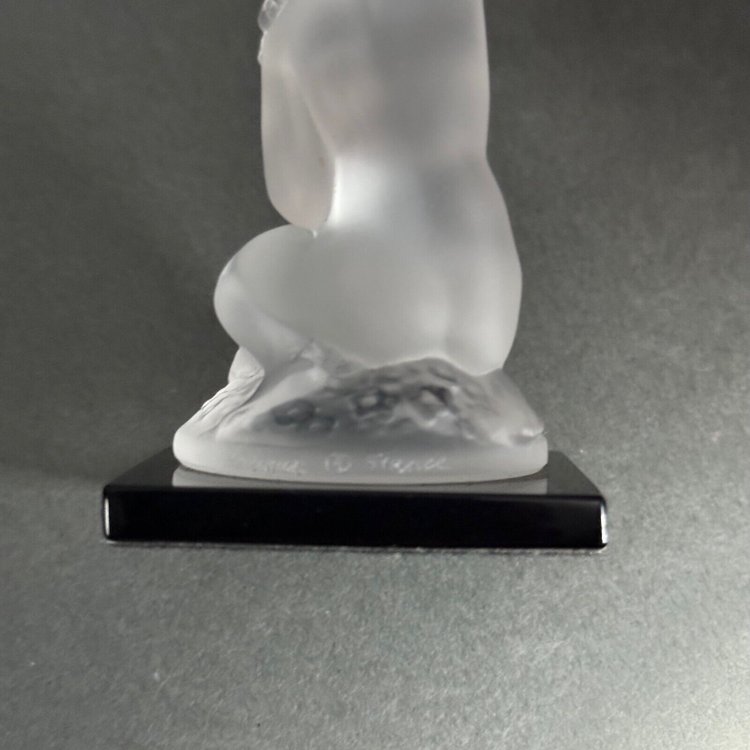 Nude female subject by Lalique in frosted glass on black base