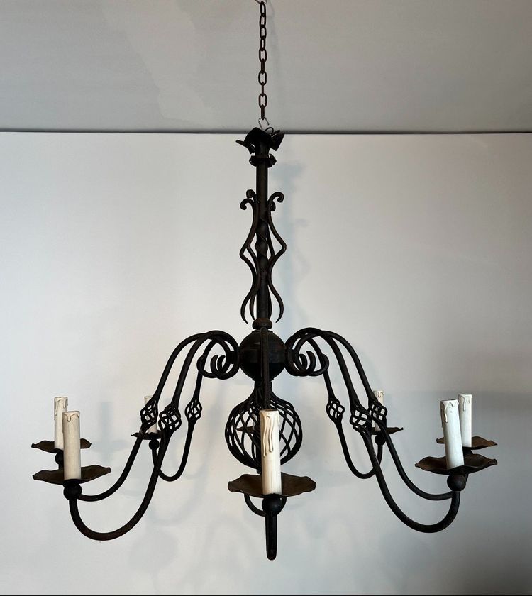 Important 8-Arm Wrought Iron Chandelier. French work. Circa 1940