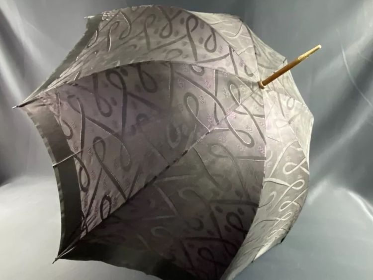 Large late 19th century parasol with carved mauve stone knob and possible gold ring