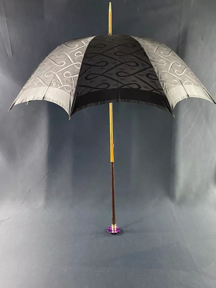 Large late 19th century parasol with carved mauve stone knob and possible gold ring