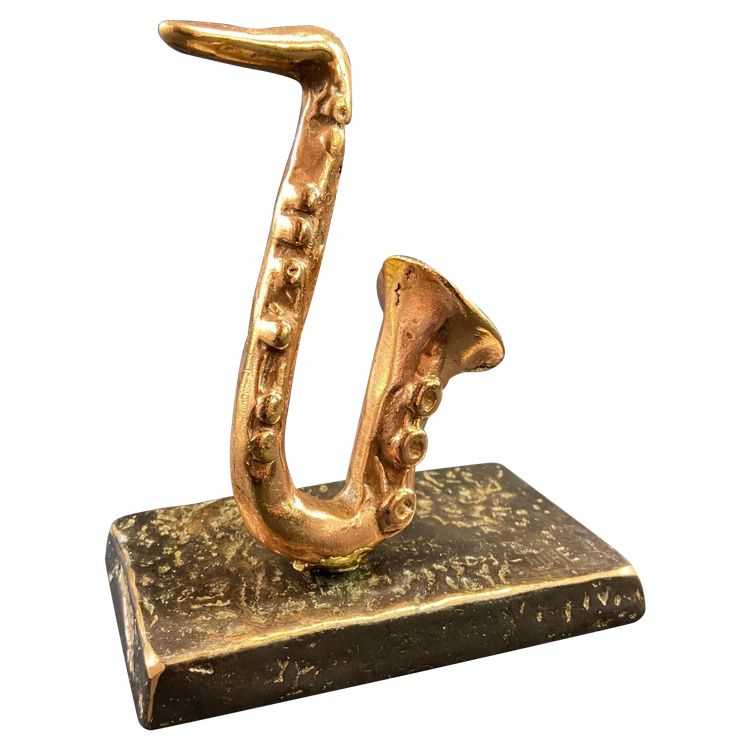 Carved saxophone subject in bronze signed Yves Lohé