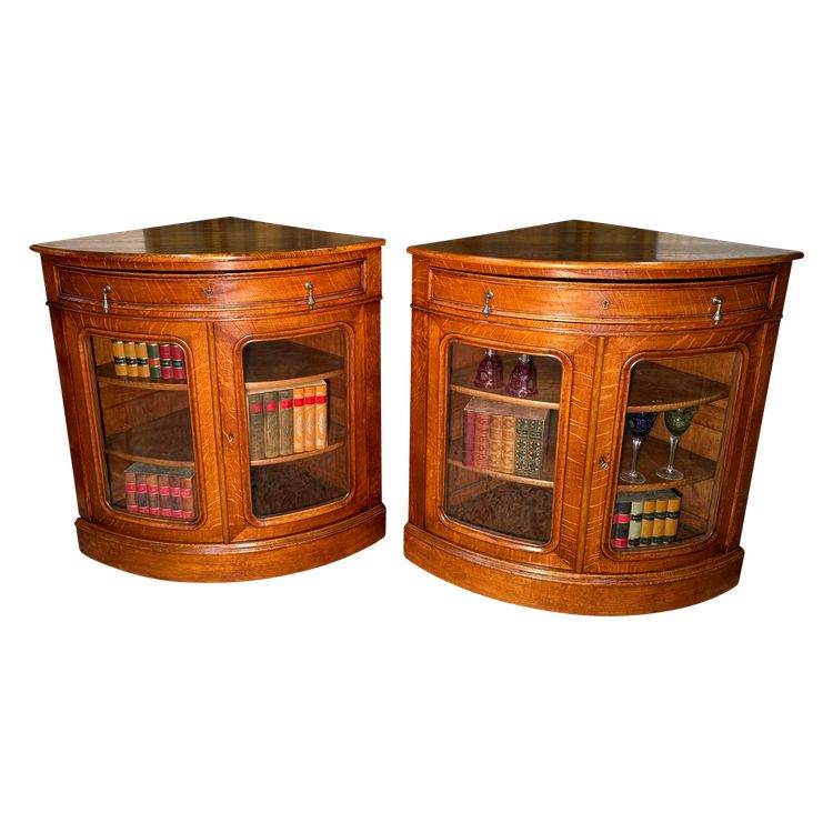 Pair of 19th century glass corner cabinets in blond oak