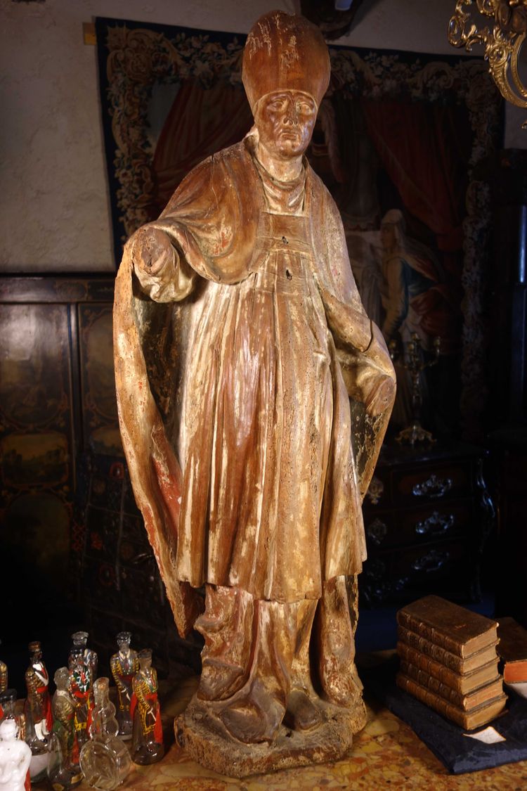 Large, formerly polychrome statue of a bishop