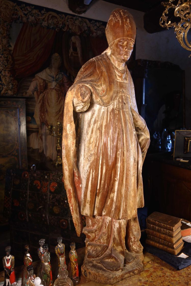 Large, formerly polychrome statue of a bishop