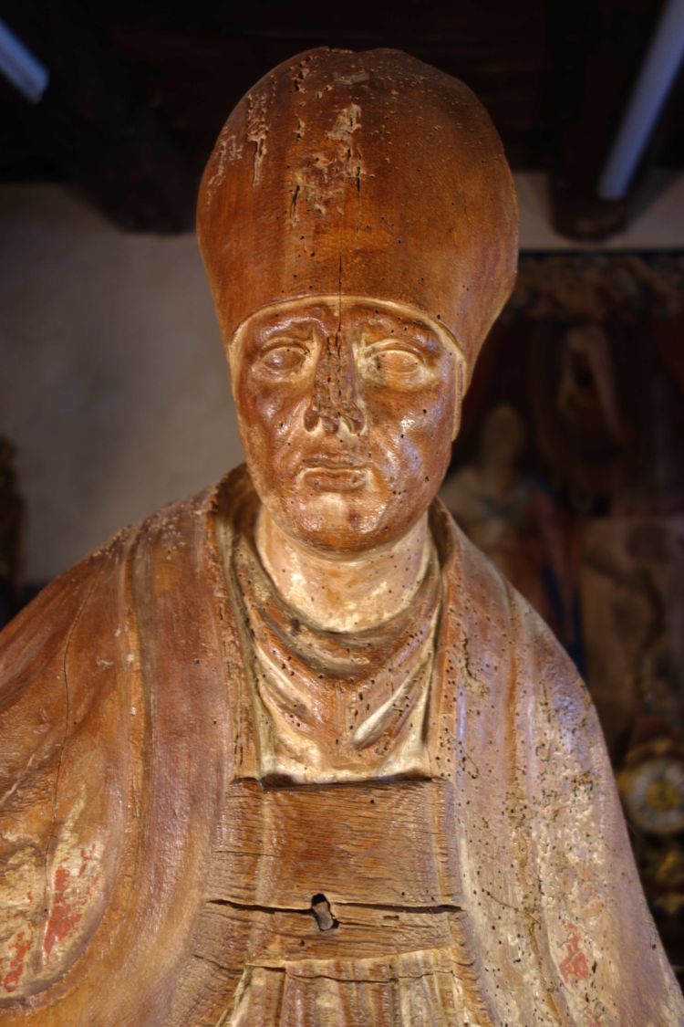 Large, formerly polychrome statue of a bishop