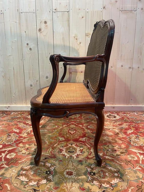 Louis XV mahogany and cane bench