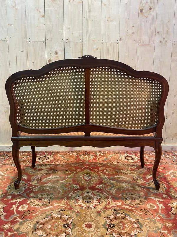 Louis XV mahogany and cane bench