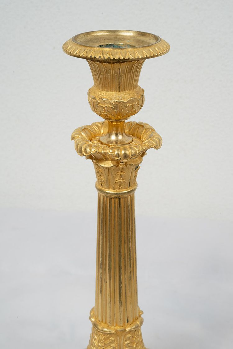 Pair of antique Empire ormolu candlesticks. 19th century.