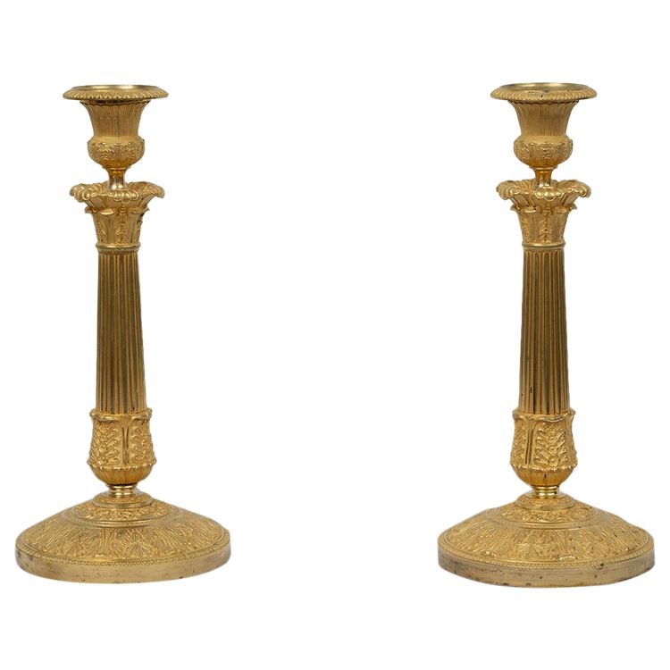 Pair of antique Empire ormolu candlesticks. 19th century.