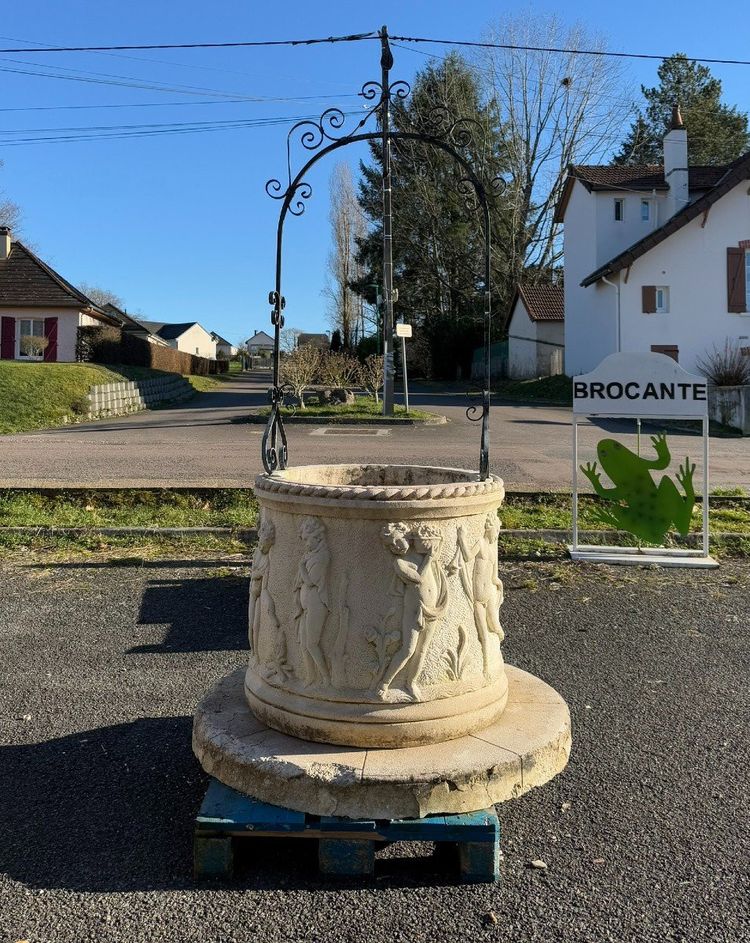 Reconstituted stone well with antique decorations circa 1950