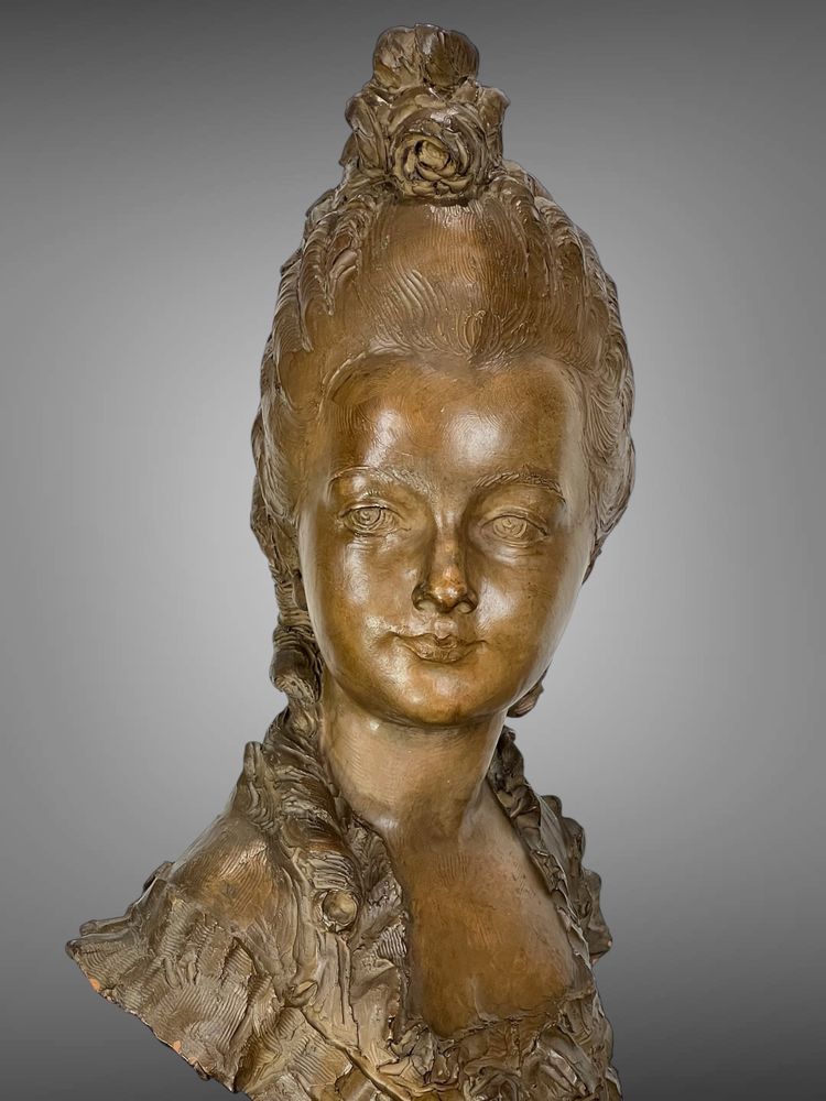 FERNAND CIAM 1886 - 1954 BUST OF A YOUNG WOMAN IN PATINATED TERRACOTTA ON A BASE